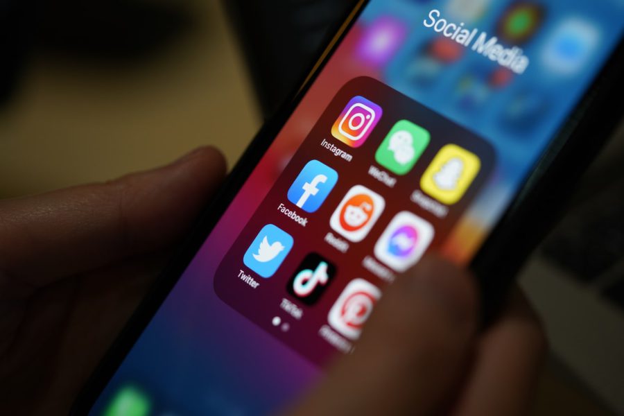 What's trending on social media? this is a picture of iphone's social media folder showing instagram, snapchat, facebook, and more.