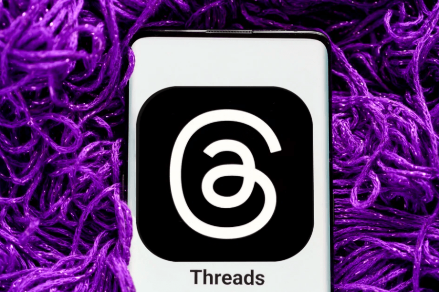 Photo of Threads App Icon on an iphone with purple threads around it