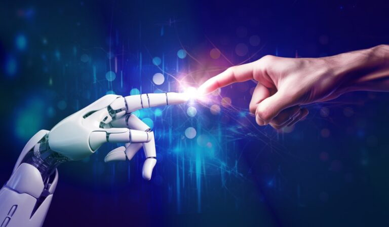 Photo of robot and human fingers touching